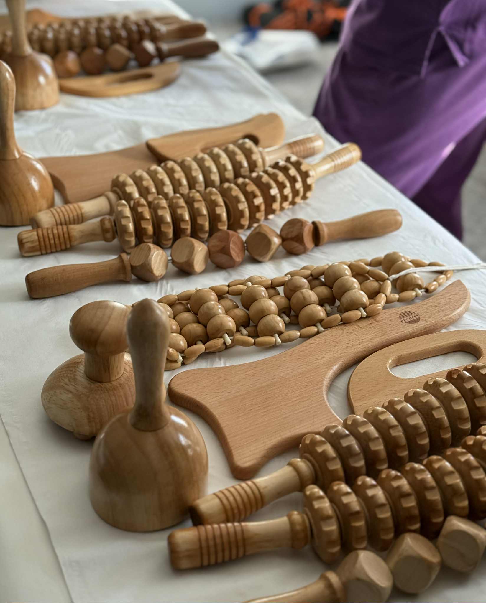 Wood Maderotherapy and Brazilian Lymphatic Drainage tools on a body